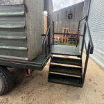 Bespoke stairs on the back of a beaters wagon