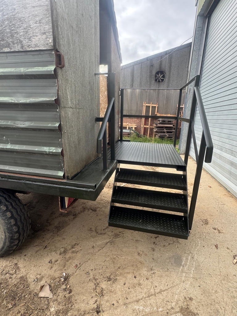Bespoke stairs on the back of a beaters wagon