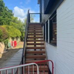 External steel staircase with wooden tread detail